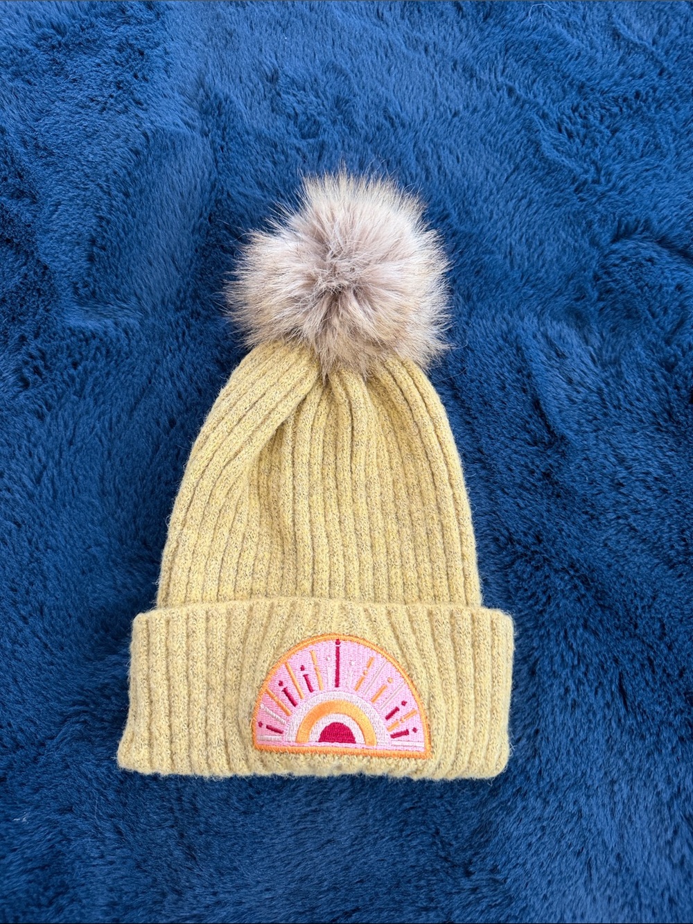 Women’s Mustard Knit Pom Beanie with Rainbow Patch